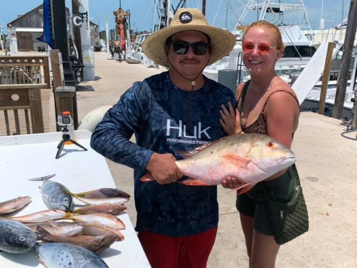 a person holding a fish