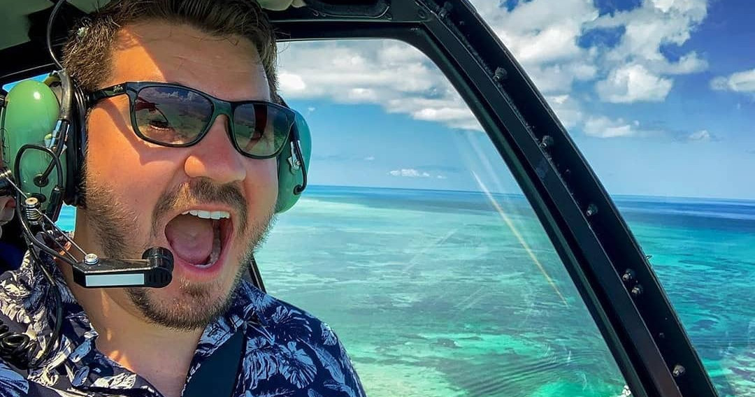 The Ultimate Island Experience Image 1 a man wearing sunglasses driving a car